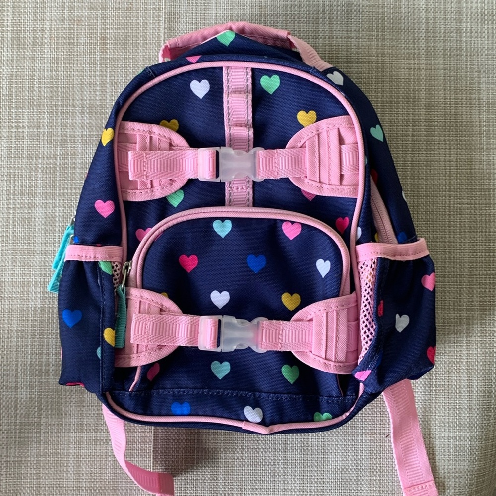 Pottery Barn Kids Mackenzie Small Backpack, Navy with multi colored hearts.